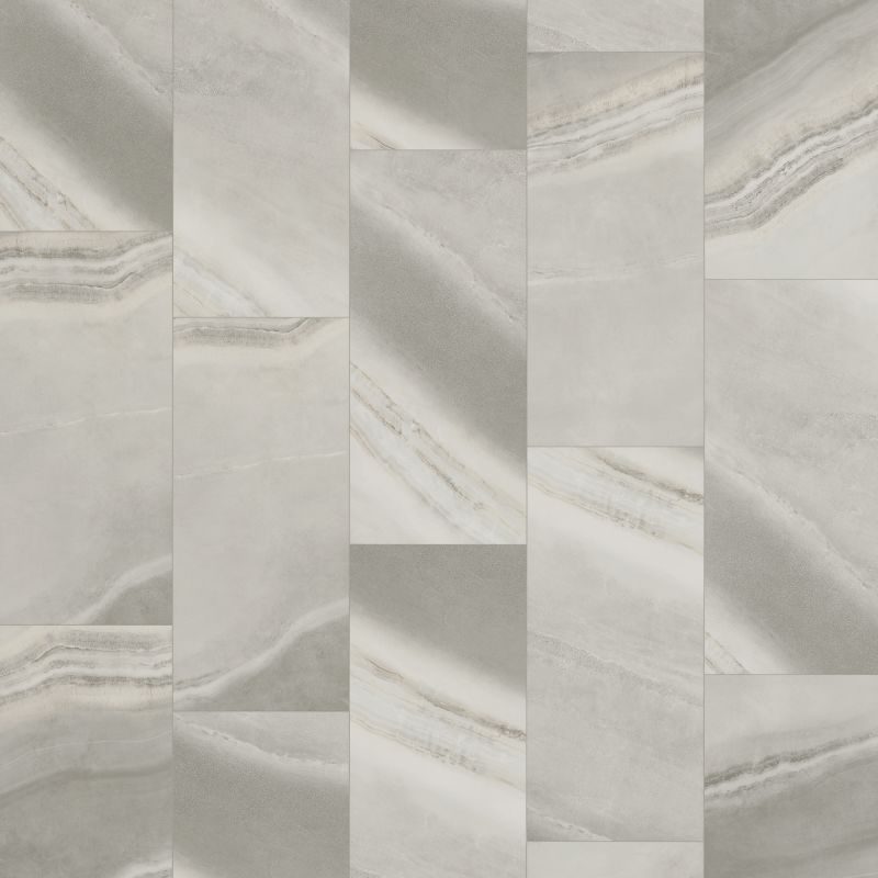 Tall grey marble-effect porcelain tiles stacked in a staggered grid, each streaked with pale veining.