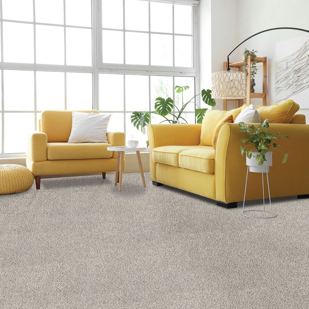 The Clearwater carpet fitted in a living room with a yellow sofa